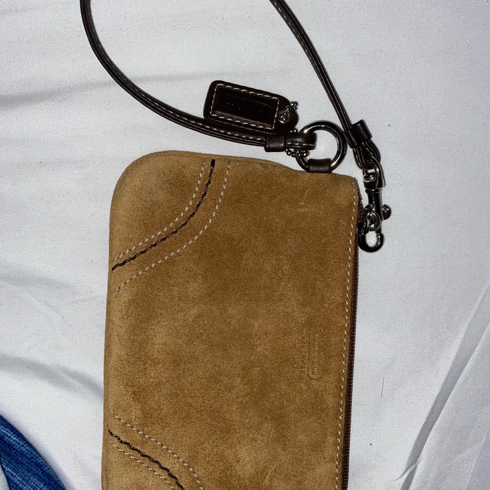 Brown, beige, wristlet coach bag with zipper